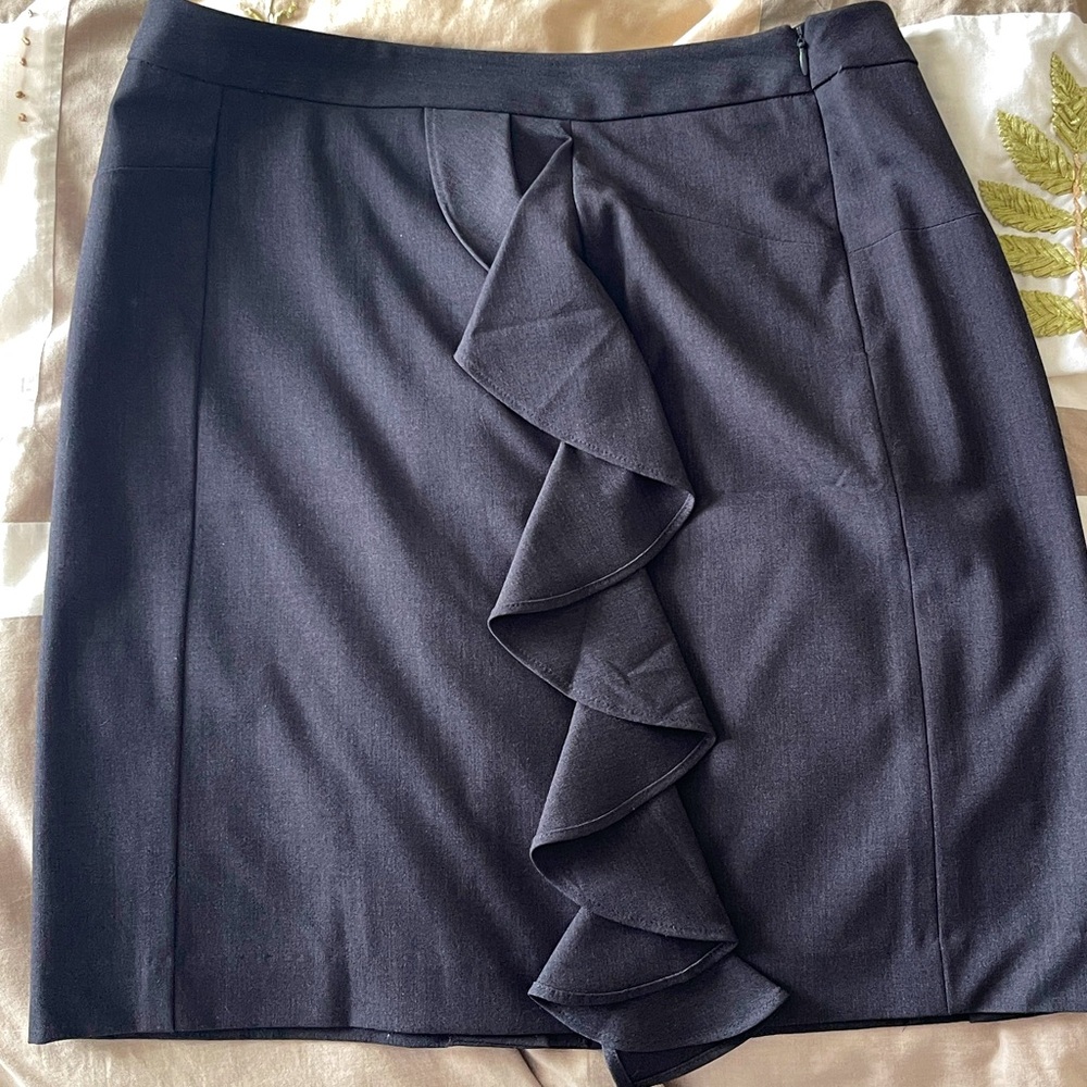 New without tags pencil skirt with ruffles in front and zip up on hip size 10